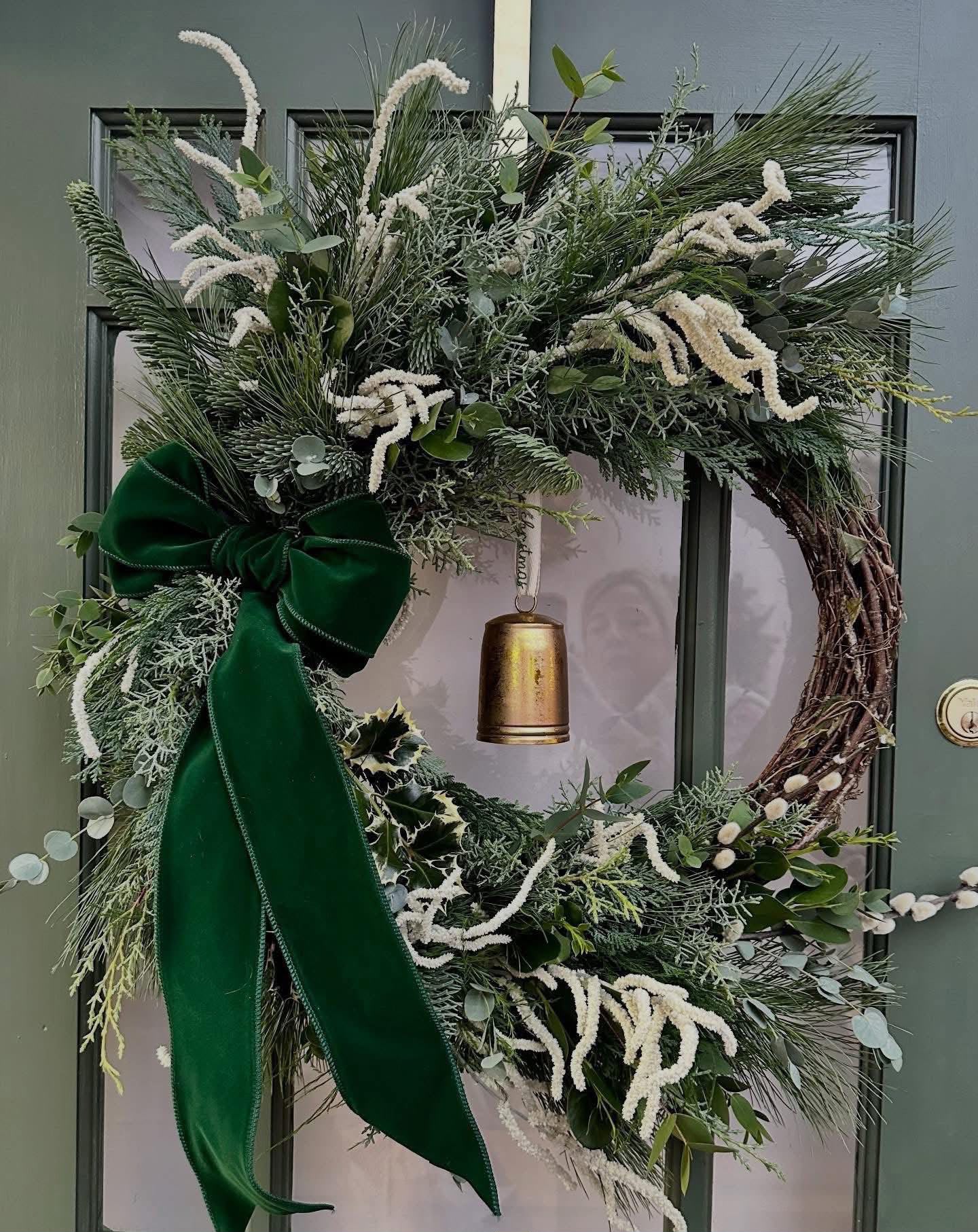 Hand-tied Christmas arrangement by Willow and Moss