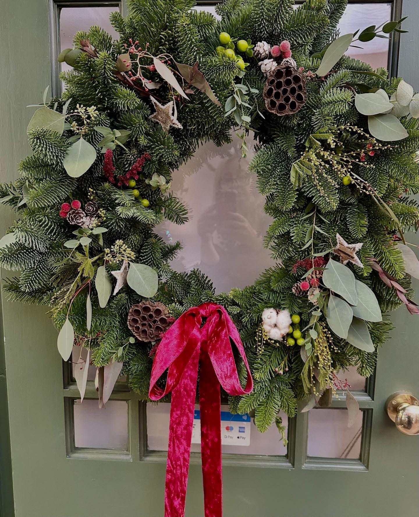 Hand-tied Christmas arrangement by Willow and Moss