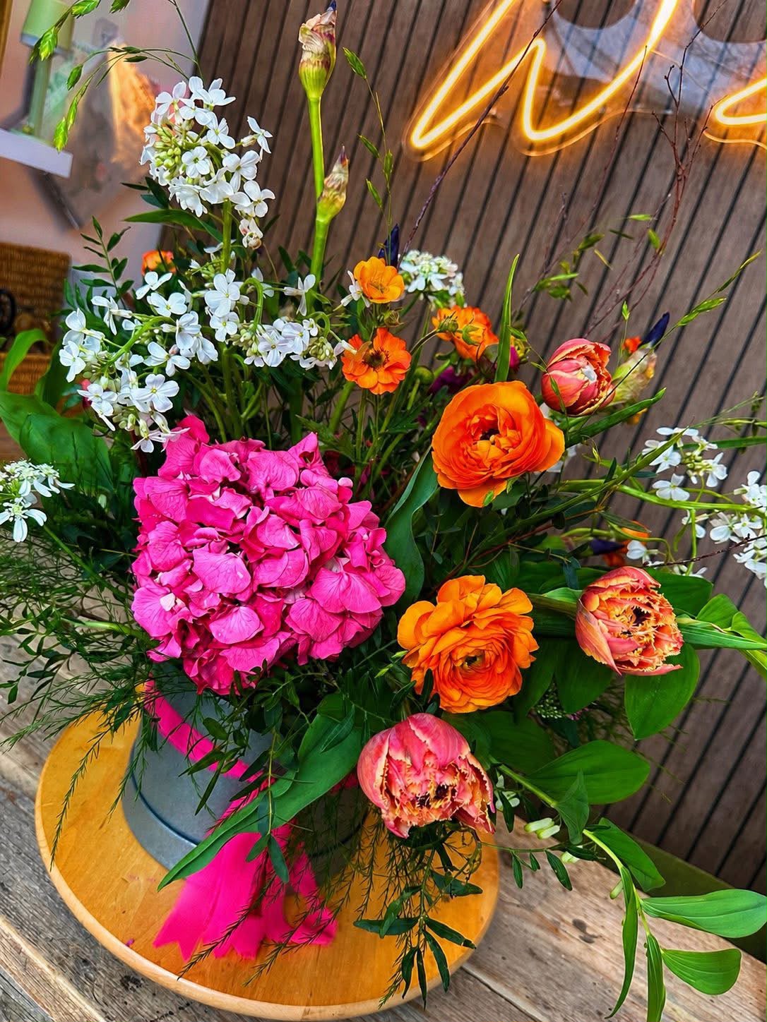 Flowers arranged in a hat box by Willow and Moss