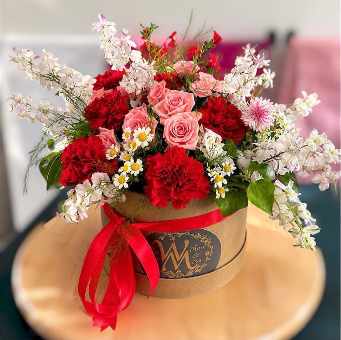Seasonal hat box arrangement by Willow and Moss