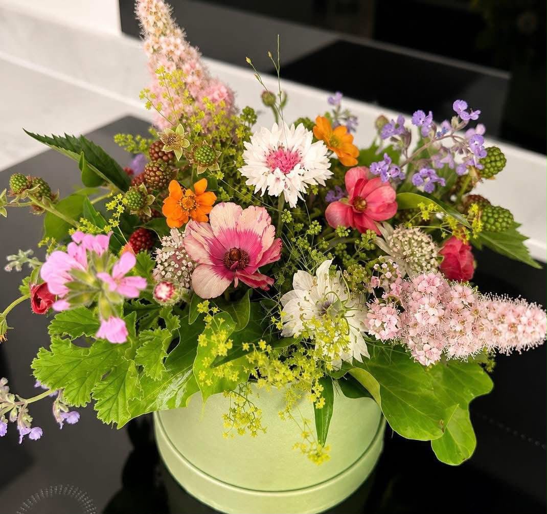 Hand-tied hat box of flowers by Willow and Moss