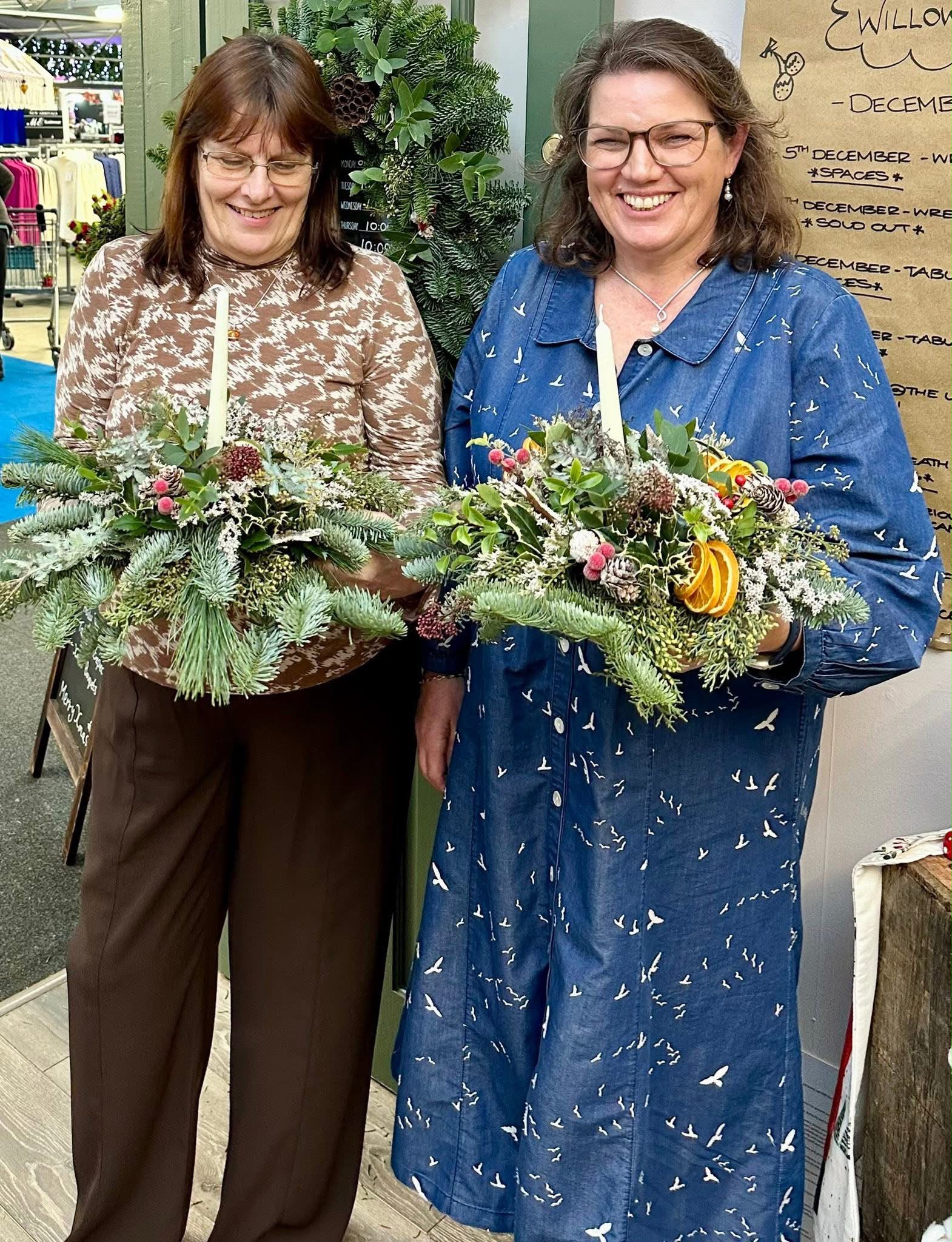Guests arranging flowers at a Willow and Moss workshop